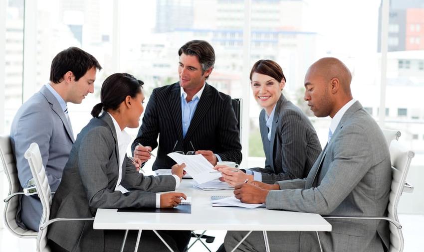 Multi-ethnic business people disscussing a budget plan in a meeting